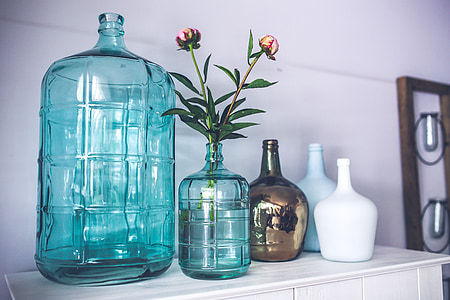 five assorted-color glass vases thumbnail