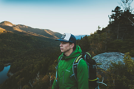 person mountain climbing during daytime thumbnail