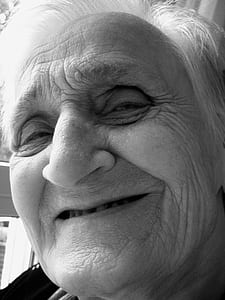 grayscale photography of smiling woman thumbnail