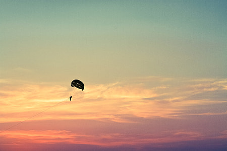 person on parachute during daytime thumbnail