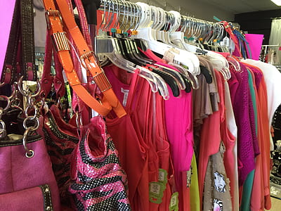 assorted-color dresses hanged on silver clothes rack thumbnail