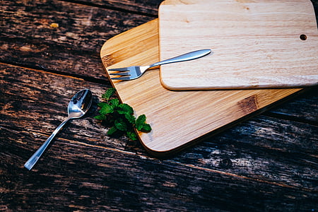 stainless steel fork on top of brown tray near stainless steel spoon thumbnail
