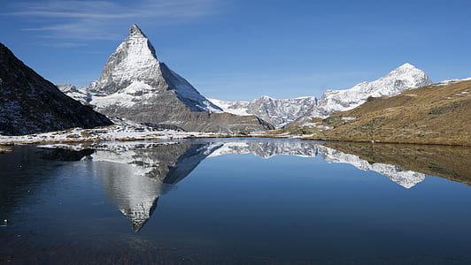 view of mountain coated with white snow thumbnail