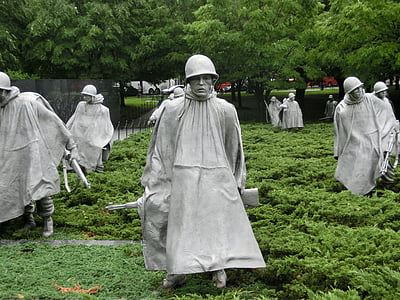 soldier statues on green grass field thumbnail
