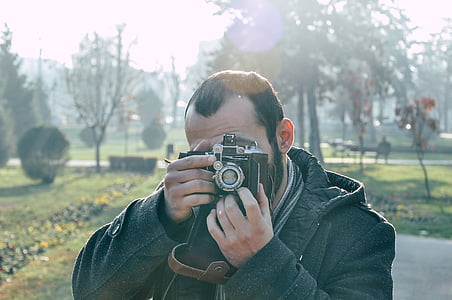 man taking photo during daytime thumbnail