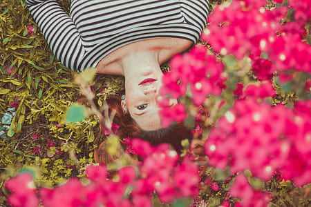 woman lying on green grass thumbnail