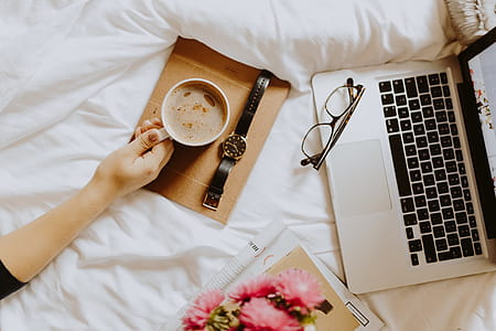 Morning coffee in bed. Working in bed thumbnail