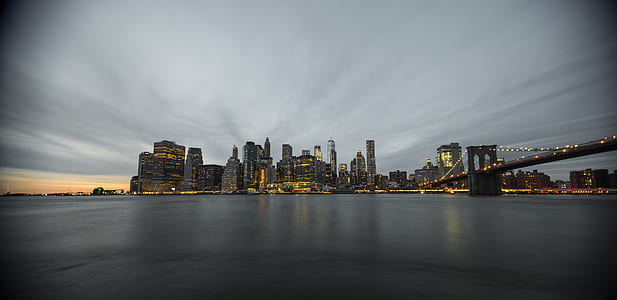 concrete buildings near body of water thumbnail