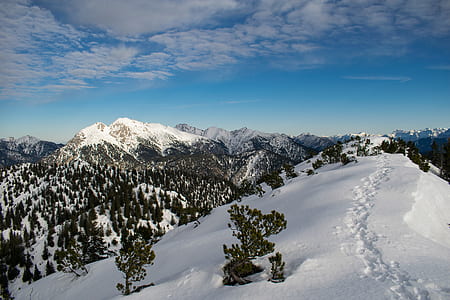 landscape photography of snowy mountain under cloudy sky thumbnail