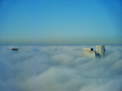 white clouds covering buildings thumbnail