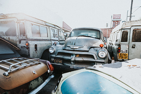 gray vehicle beside the two white vehicles thumbnail