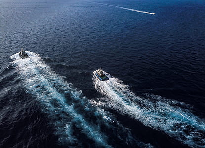 aerial view of boats surrounded by body of water thumbnail