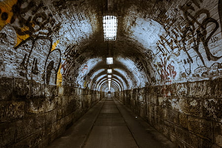 gray and brown concrete tunnel thumbnail