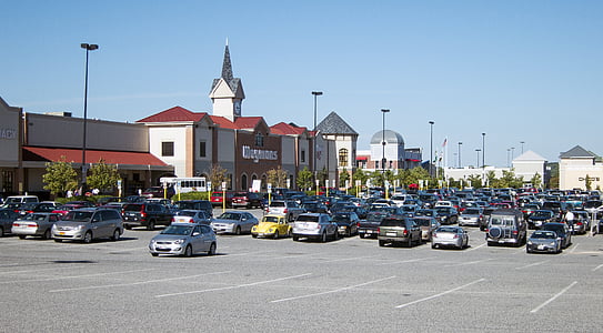 vehicle parked on parking area near buildings thumbnail