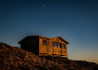 brown wooden house on the top of gill thumbnail