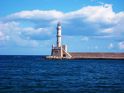white lighthouse near body of water thumbnail