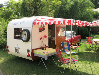 white recreational vehicle beside car thumbnail