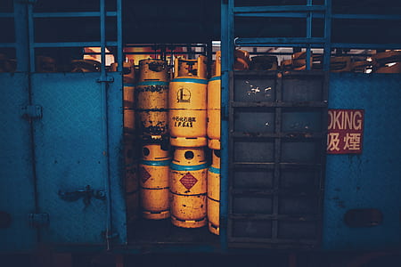 orange propane tanks beside door thumbnail