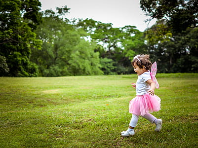 girl walking on grass thumbnail