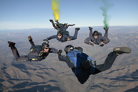 four men skydiving thumbnail