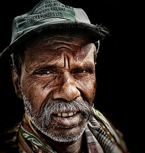 selective focus photography of man's face thumbnail