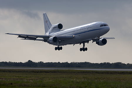 airplane several feet above ground during day thumbnail
