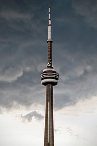 brown and white space needle with gray clouds during daytime thumbnail