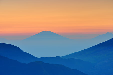 silhouette of mountain during golden hour thumbnail