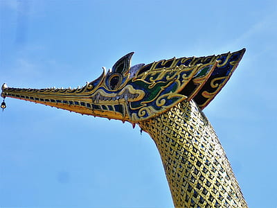brass-colored dragon head statue thumbnail