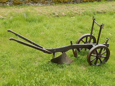 brown wooden gardening equipment on grass field thumbnail