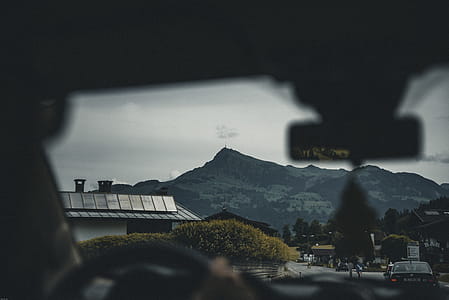Person Sitting on Car Seat Viewing Mountain thumbnail