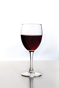 long-stem glass with wine on white surface thumbnail