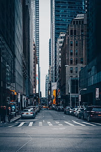 man's eyeview of buildings near road during daytime thumbnail