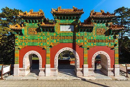 red and green concrete temple front of trees thumbnail