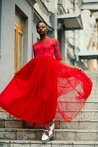 Woman Wear Red Elbow-sleeved Dress Walking on Stair thumbnail