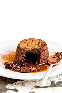 chocolate cake on white ceramic plate with silver spoon thumbnail
