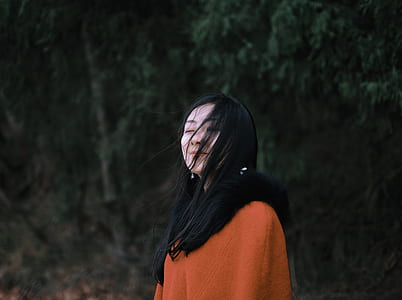 woman standing near trees thumbnail