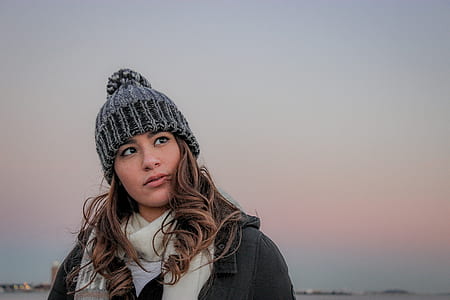 woman wearing knit cap while seeing left side thumbnail