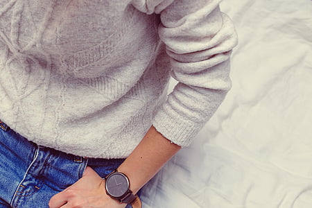 man sitting on white bed comforter thumbnail