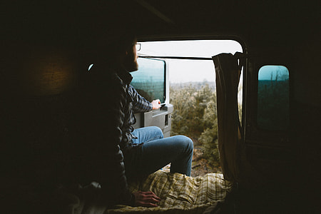 person sitting while opening the door of a vehicle thumbnail