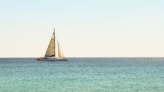 photo of white and beige sailboat during daytime thumbnail