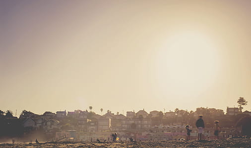 three person standing on field thumbnail