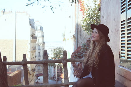 woman sitting near window thumbnail