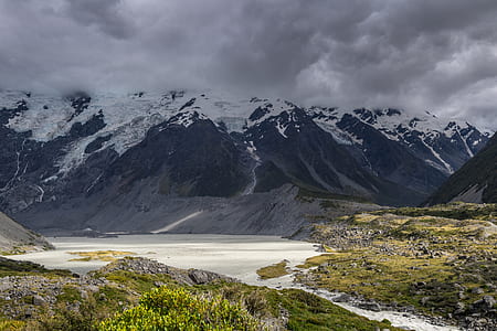 black and white mountains under white and gray sky at daytime thumbnail