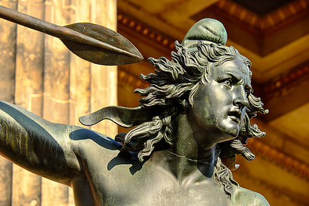 closeup of male statue holding spear thumbnail