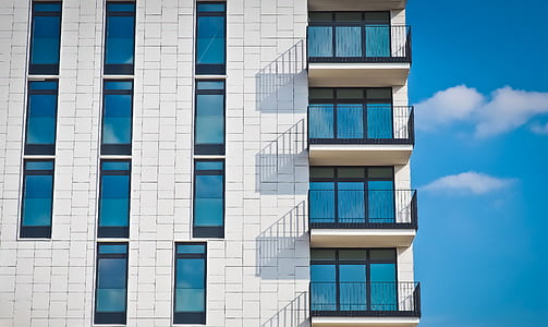 low-angle photo of white concrete high-rise building thumbnail