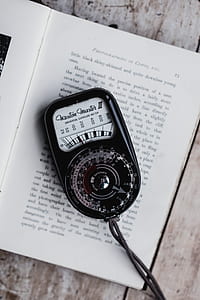 Waston Master III displaying 100 light on opened book page thumbnail