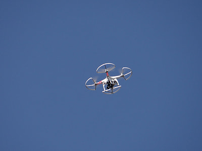 white DJI Phantom drone in the sky thumbnail