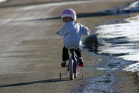 girl ride on bike on road thumbnail