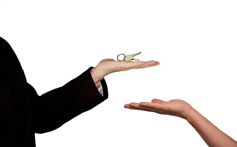 person holding brown key thumbnail